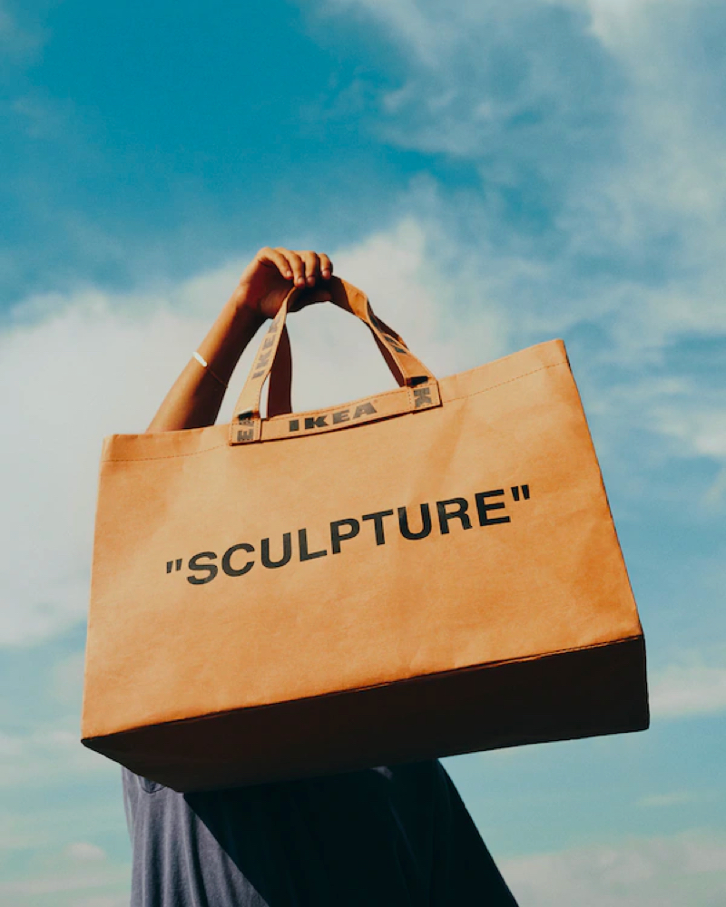 A person holding a bag with the words 